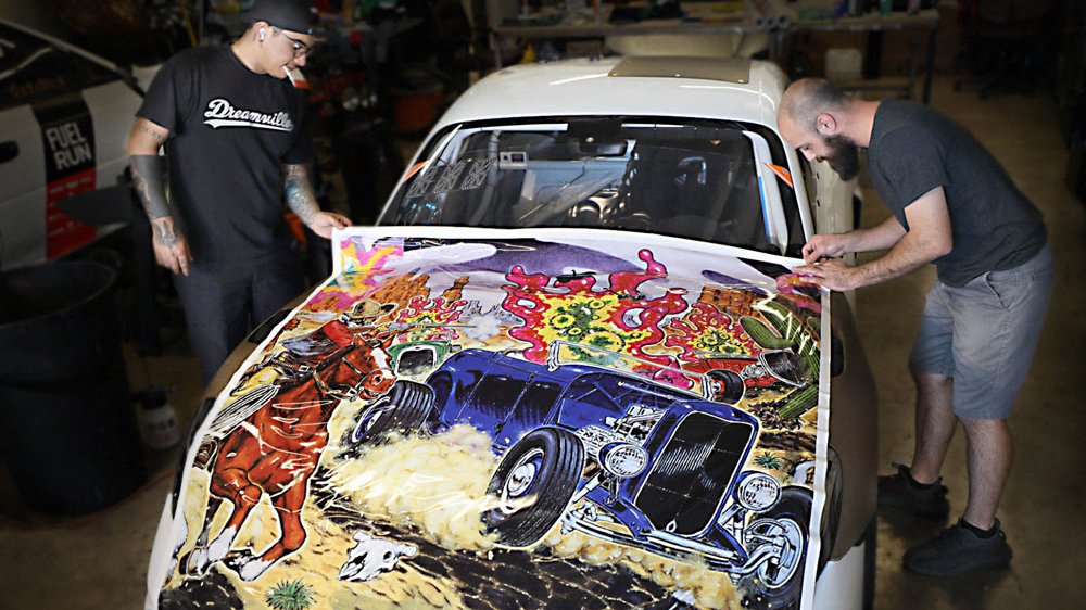The team at Paint Protection Fanatics expertly wrapping a unique Porsche 718 Cayman GT4 RS Clubsport featuring the a piece by artist Robt. Williams.