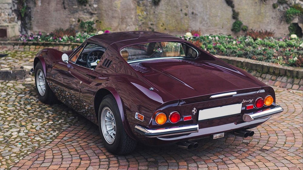 A rear 3/4 shot of the 1973 Ferrari Dino 246 GTS “Chairs & Flares” by Scaglietti