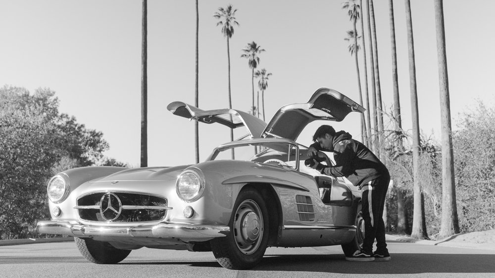 Photographer Daniel Malikyar photographing a Mercedes-Benz 300 SL 