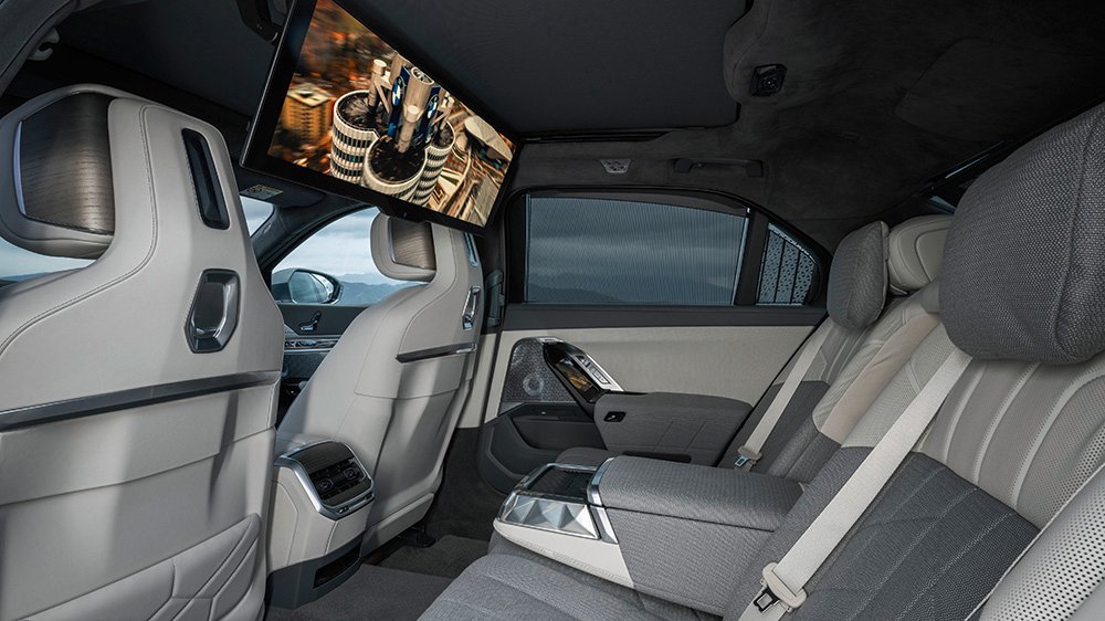 The 2023 BMW i7's rear seat with the theater screen down