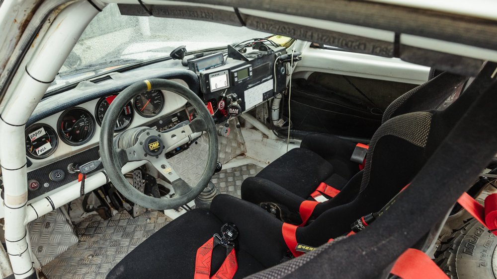 The interior of a 1982 Porsche 911SC that raced in the Dakar Classic.