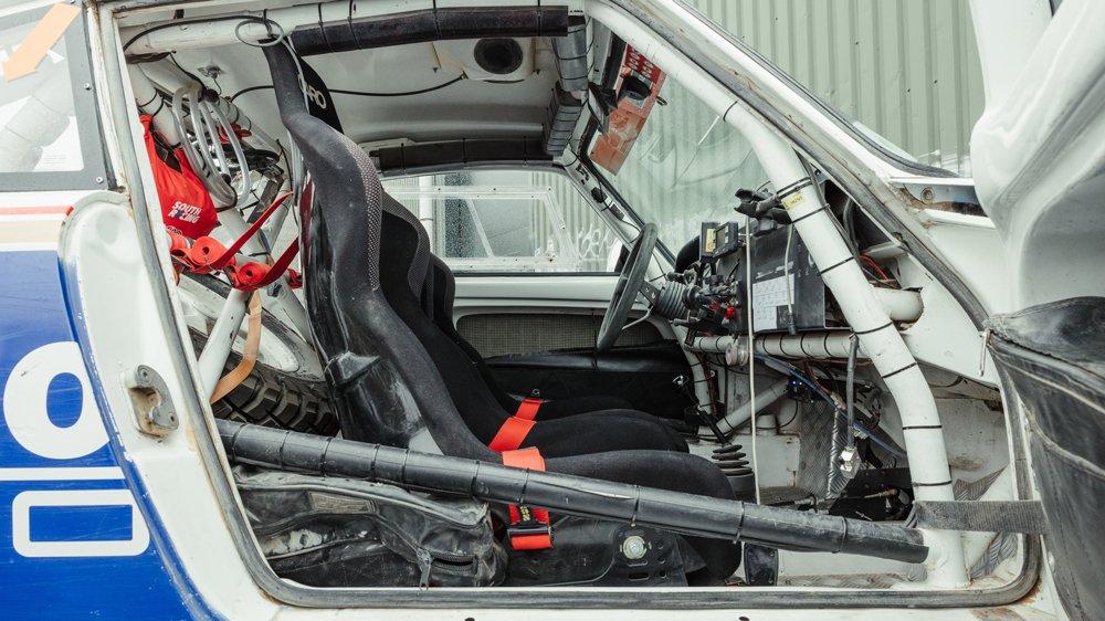 The interior of a 1982 Porsche 911SC that raced in the Dakar Classic.