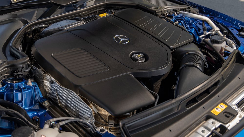 The mild-hybrid, 2.0-liter turbocharged four-cylinder engine inside the 2022 Mercedes-Benz C 300 4Matic sedan.