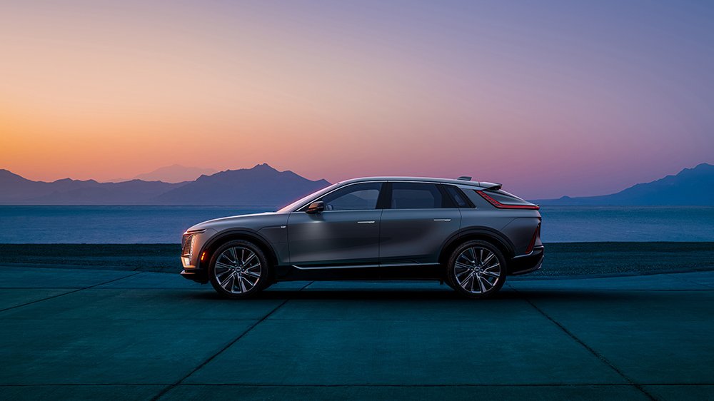 The 2023 Cadillac Lyriq from the side at sunset