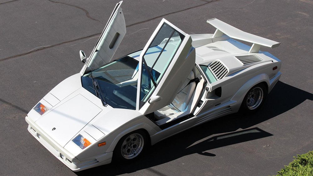 the 1989 Lamborghini Countach 25th Anniversary Edition with its scissor doors open