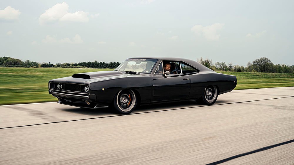 The Speedkore's 1968 Dodge Charger Hellucination speeding on a track
