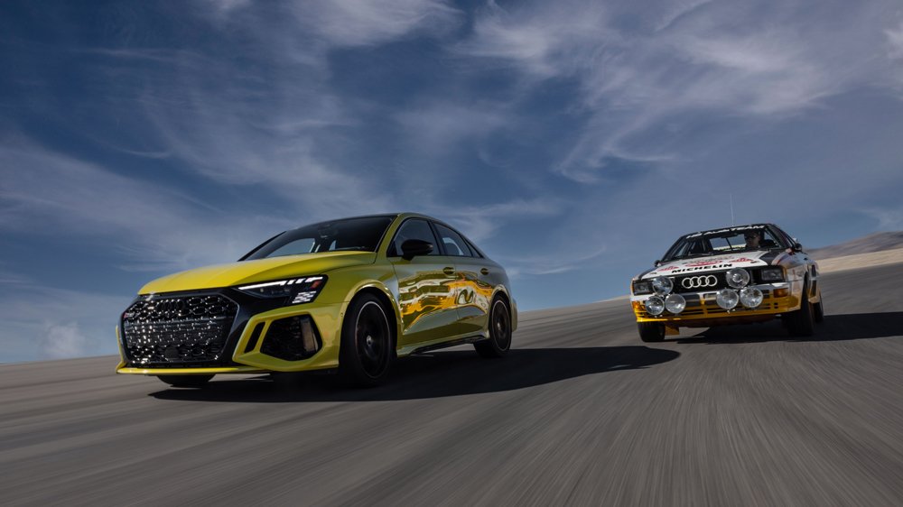 The 2022 Audi RS 3 (left) and the Audi Rallye Quattro A2 on the track at Spring Mountain Raceway in Pahrump, Nev.