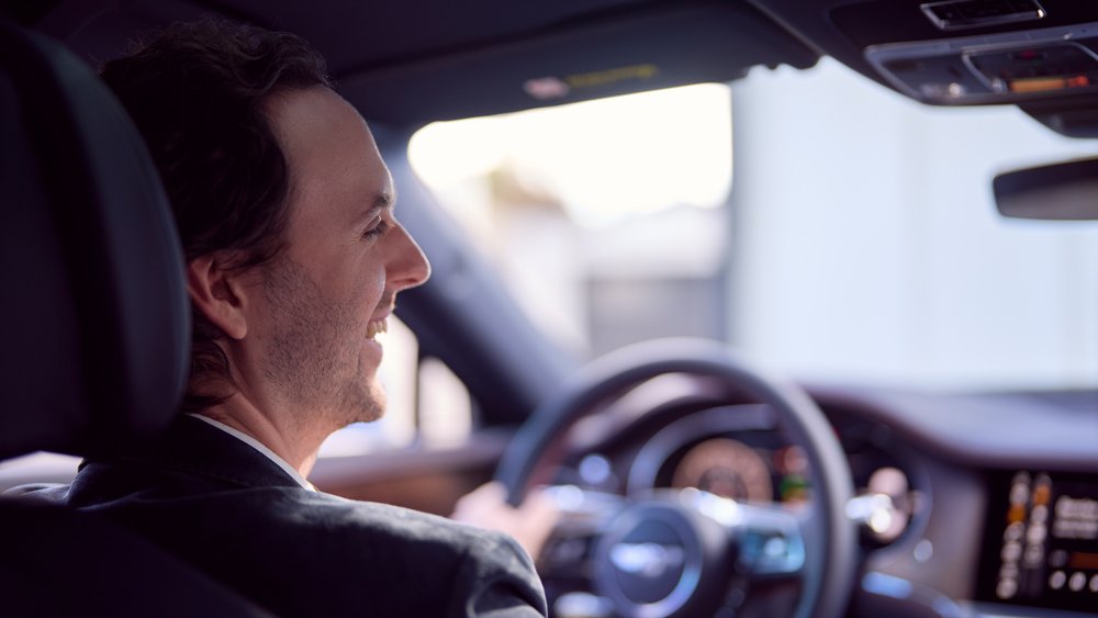 Film composer Steve Mazzaro sits in a Bentley listening to his composition done exclusively for the luxury automaker.