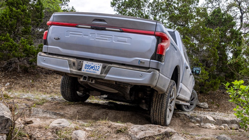 A Ford F-150 Lightning does some off-road exploration.