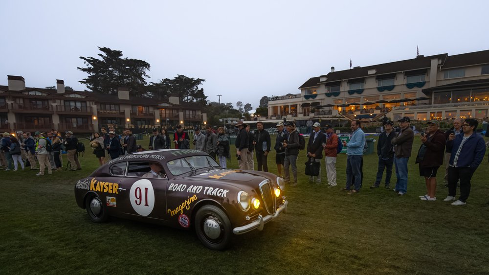 Attendees arrive early at the 2022 Pebble Beach Concours d'Elegance to watch the show cars take their positions.