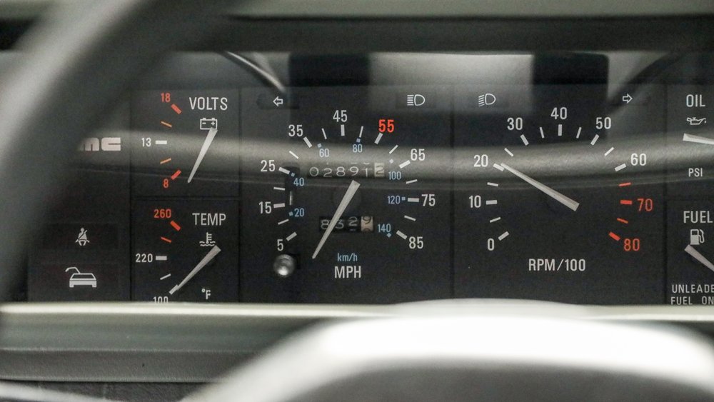The dashboard gauges of a 1982 DeLorean DMC-12.