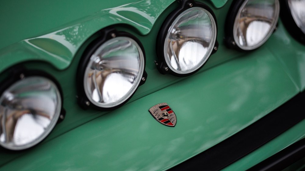 A close-up of the extra headlights on a Porsche 911 given rally-style modifications by the Keen Project.