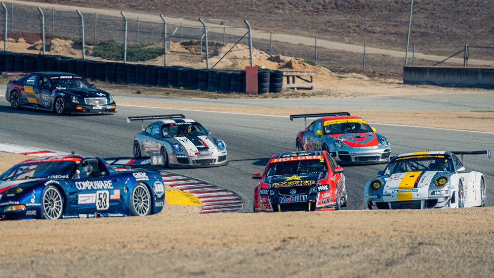 Race cars from 1995 through 2012 share the track as part of the 2022 Velocity Invitational.