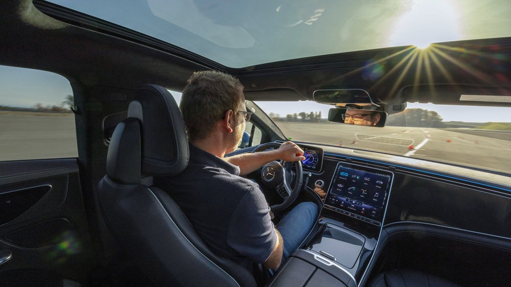A driver pilots a Mercedes-Benz EV at the automaker's test facility in Immendingen, Germany.