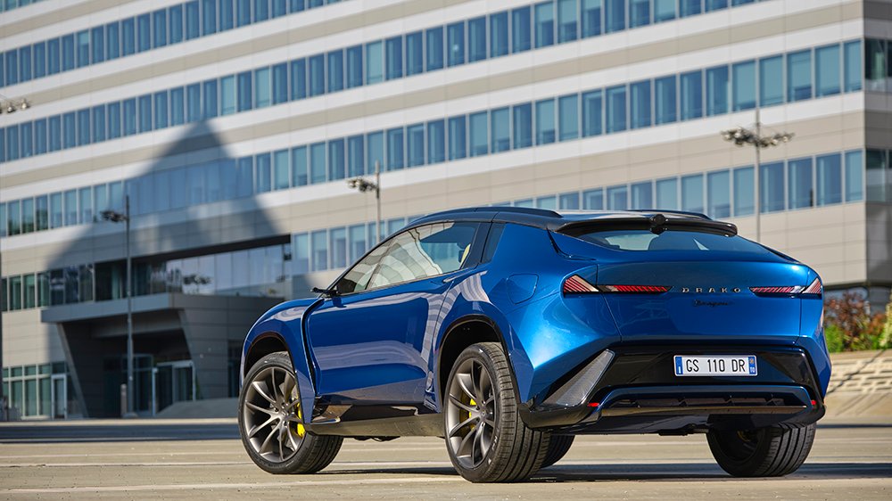 A rear 3/4 view of the Drako Dragon EV