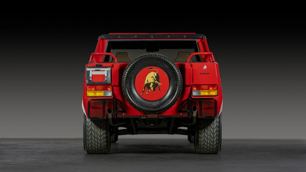 The back of a red 1991 Lamborghini LM002.