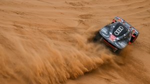 Team Audi Sport racers Carlos Sainz Sr and Lucas Cruz in their Audi RS Q e-tron E2 during Stage 8 of the 2023 Dakar Rally.