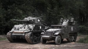 An M4 Sherman E8 sits alongside a 1943 M16 Half-Track at Drive a Tank in Kasota, Minn.