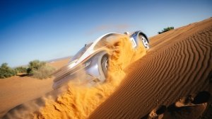 Porsche's 911 Dakar, in the optional Rallye Design Package trim, motoring through the Moroccan desert.