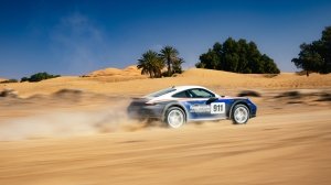 Porsche's 911 Dakar, in the optional Rallye Design Package trim, motoring through the Moroccan desert.