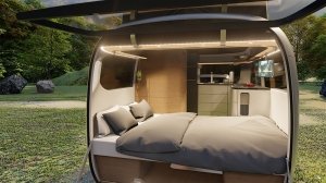 The Airstream Studio F.A. Porsche Concept Travel Trailer's living area converted for sleep