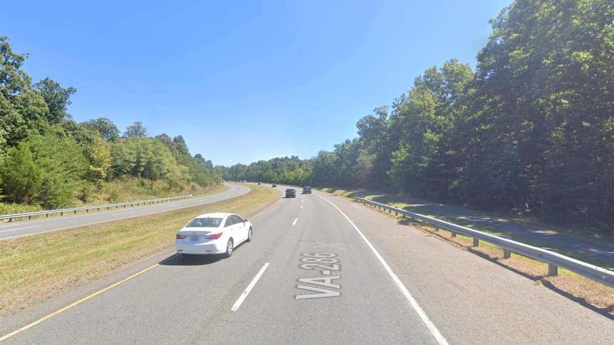 Video: Shocking footage shows police officer narrowly escape roadside collision