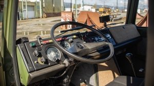 Inside the 1987 Mercedes-Benz Unimog U1300L camper conversion's front cab