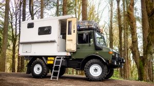 The 1987 Mercedes-Benz Unimog U1300L camper conversion from the side