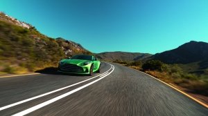 The Aston Martin DB12 on a curving road