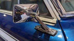 A close-up of one of the side mirrors on a 1977 Jeep Cherokee S restomod from Vigilante 4x4.