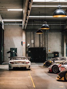 Le Mans supercars at My Garage, many awaiting repair