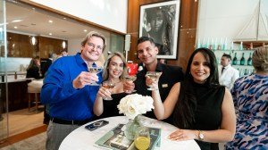 Attendees at an Excellence in Motion panel raise a glass to camaraderie.