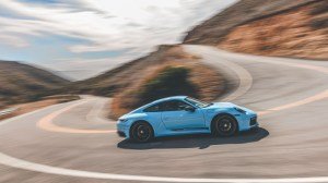 Driving a 2023 Porsche 911 Carrera T in Gulf Blue.
