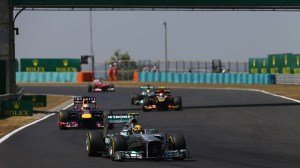 Lewis Hamilton crosses the finish line at the Hungarian Grand Prix in 2013
