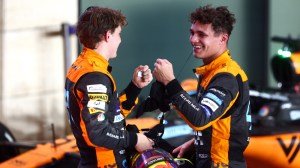 McLaren's Oscar Piastri and Lando Norris celebrate finishing second and third, respectively, at Formula 1's Qatar Grand Prix on October 8, 2023.