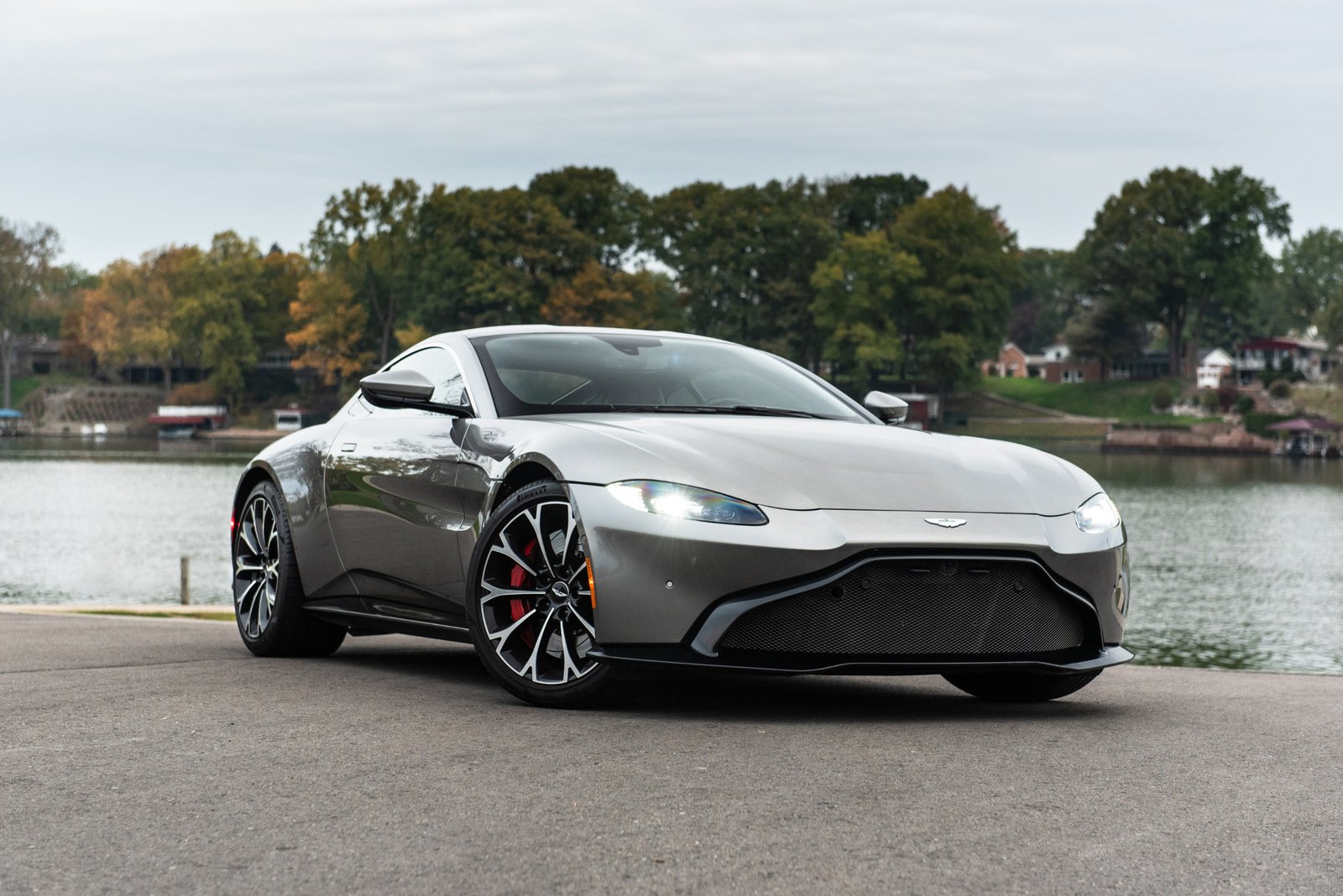 03-aston-martin-vantage-2018-angle--autumn--exterior--front--silver--trees.jpg