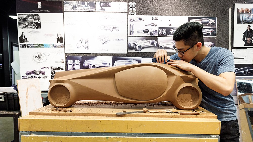 A student at ArtCenter College of Design fine-tunes his model.