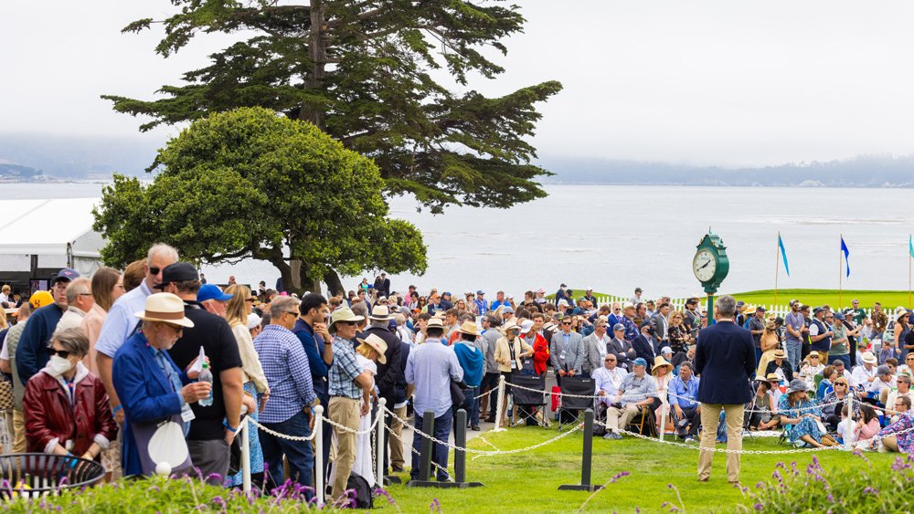 A crowd gathers to catch a glimpse of the awards ceremony at the 2021 Pebble Beach Concours d'Elegance.