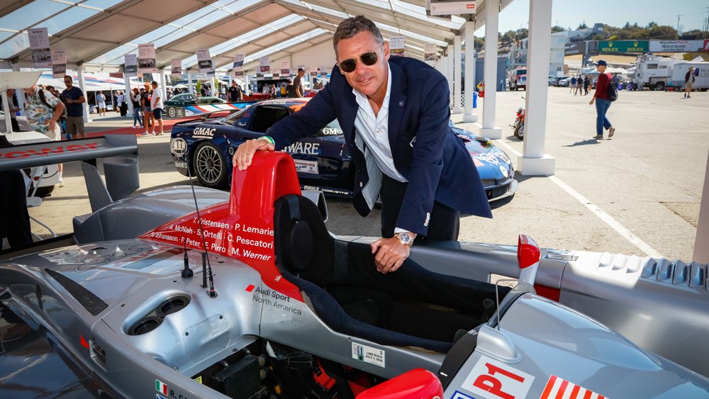 Tom Kristensen, nine-time winner of Le Mans, next to the 2005 Audi R8 LMP1 he once to victory.