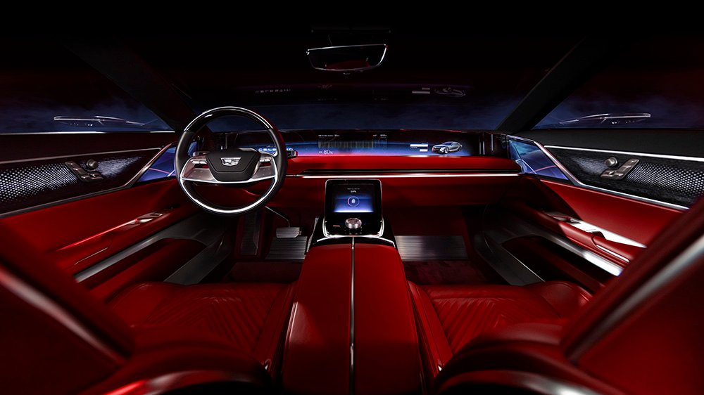 Interior view of the steering wheel, 55-inch pillar-to-pillar advanced LED screen, center console and front seats of the Celestiq show car