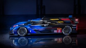 The Cadillac V-LMDh race car in blue from the side
