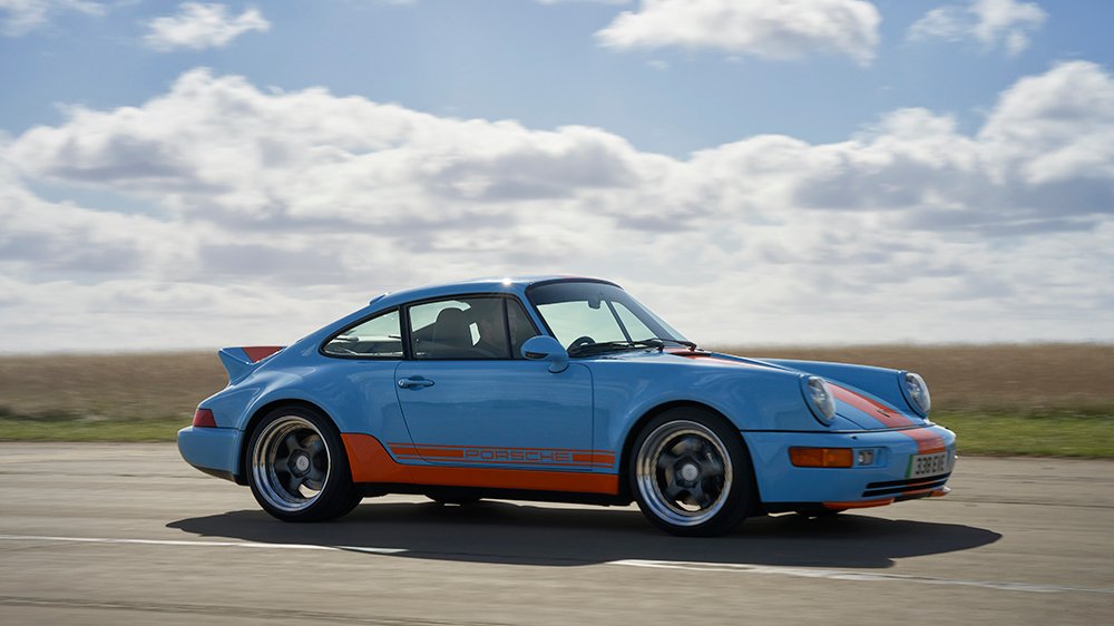 Writer Ben Oliver driving Everrati’s Porsche 911 (964) signature Gulf edition on the track