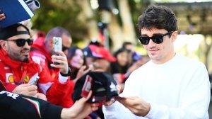 Charles Leclerc poses with fans in Australia