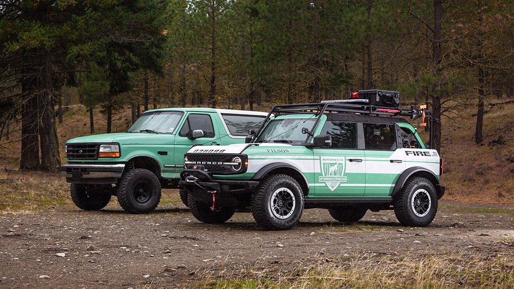 A Ford Bronco + Filson Wildland Fire Rig Concept next to a vintage U.S. Forest Service Bronco
