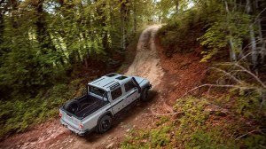 The Ineos Grenadier Quartermaster driving up a trail