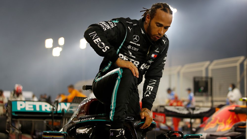 Hamilton exiting is race car after winning the Bahrain Grand Prix.