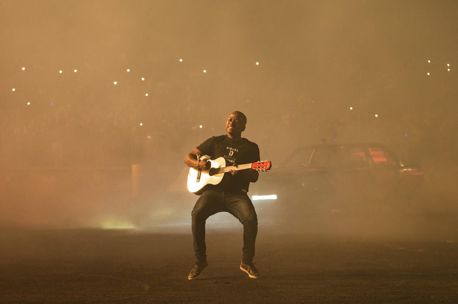 Samkeliso Thubane playing his guitar at Shay' iMoto 2022