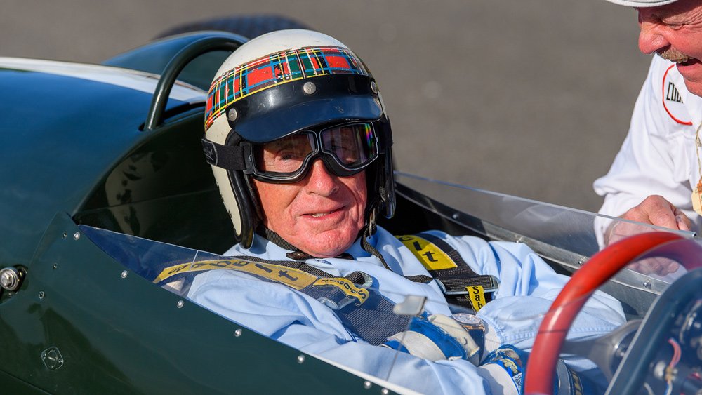 Racer Jackie Stewart drives during the 1959 TT Celebration at the 2019 Goodwood Revival.