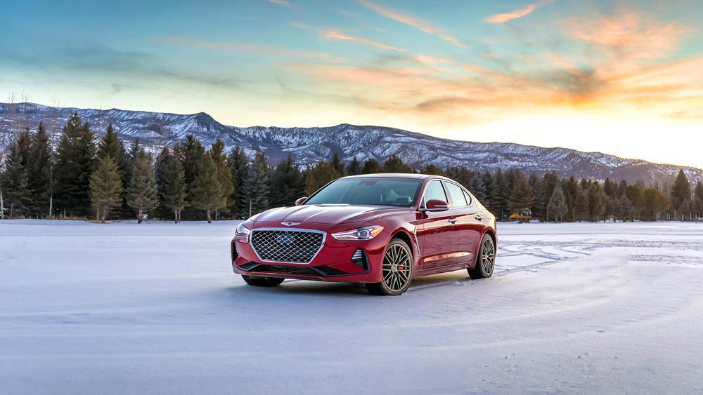 The Genesis G70 sedan being driven in snow.