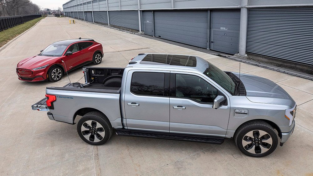 The Ford F-150 Lightning charging a Mustang Mach-E Extended Range RWD